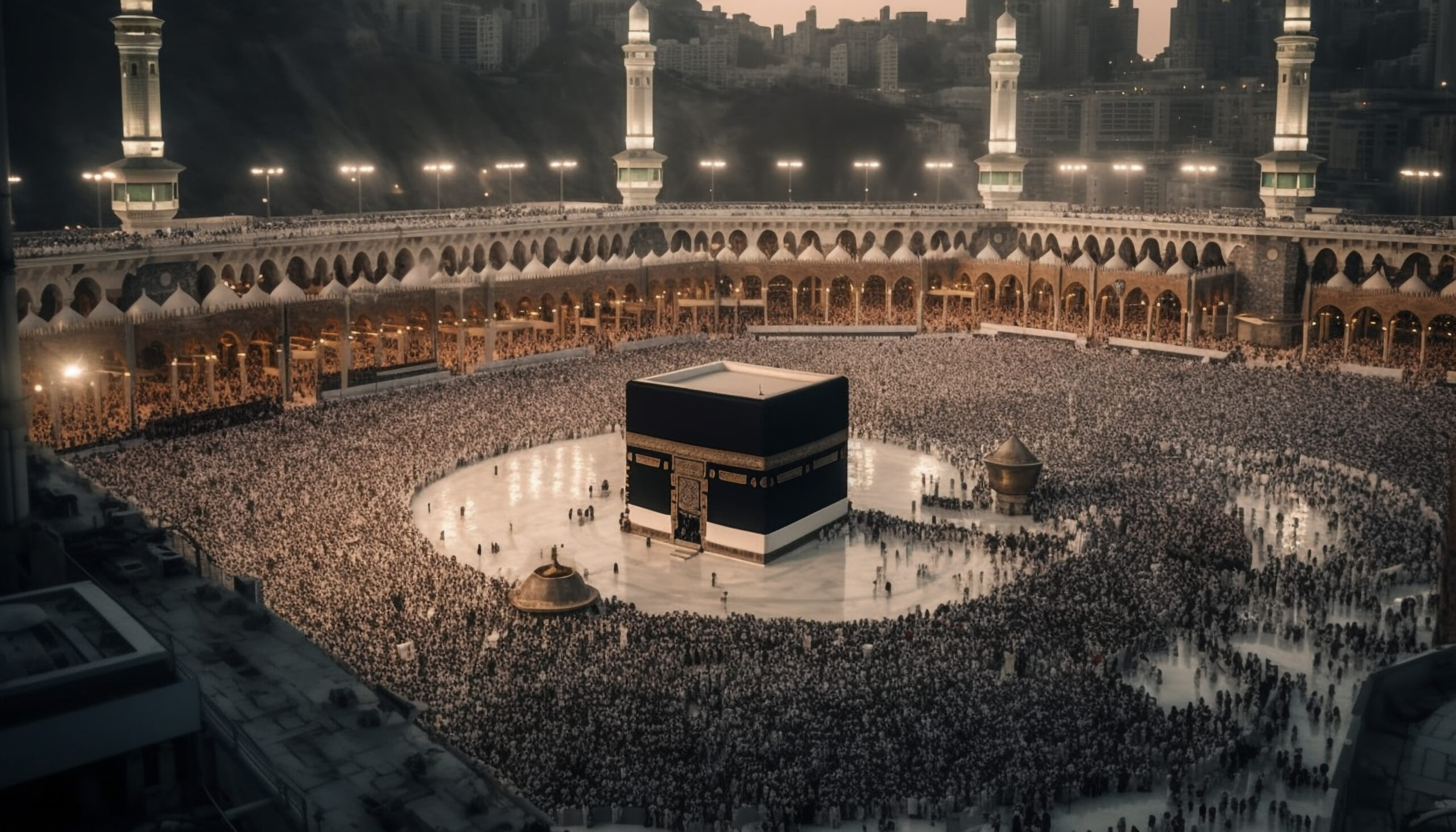 Aerial view of the Kaaba in Mecca, Saudi Arabia, surrounded by pilgrims.